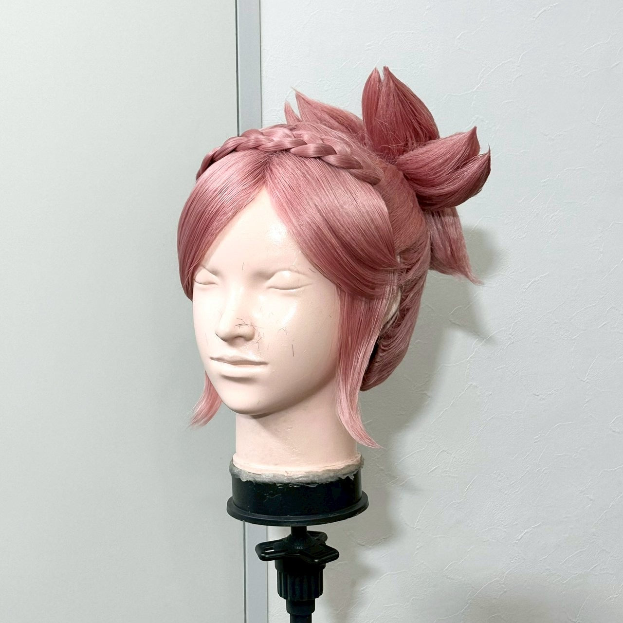 A three-quarter front view of the wig with the braided hairline