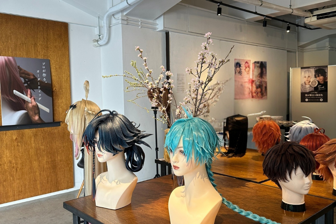 Finished commissions on stands in the Tokyo workspace, with seasonal branches and studio lighting