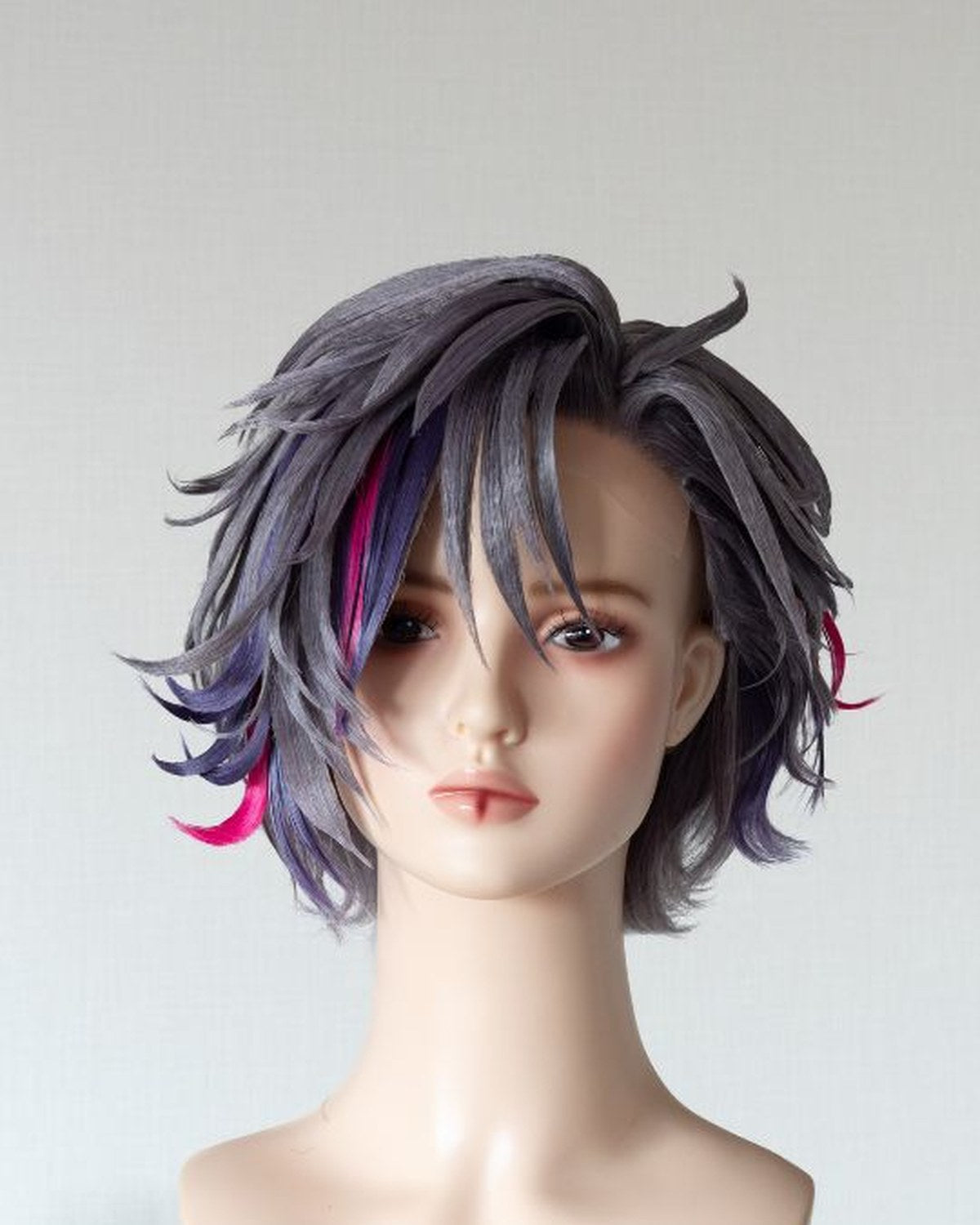 Short wig with accent colour sections and sculpted fringe